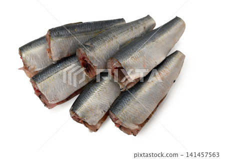 Fresh cleaned fish pieces piled on a white background Fresh cleaned fish pieces piled on a white background 141457563