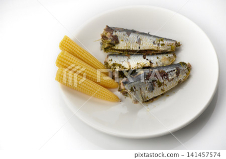 Deliciously grilled sardines served with tender baby corn, perfect for a summer meal Deliciously grilled sardines served with tender baby corn, perfect for a summer meal 141457574