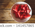 Fresh watermelon pieces in a bowl, top view 141457865