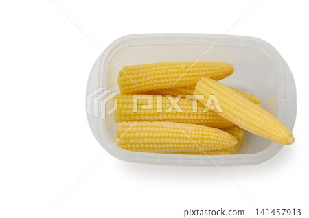 Freshly harvested baby corn arranged neatly in a clear plastic container ready for cooking or snacking Freshly harvested baby corn arranged neatly in a clear plastic container ready for cooking or snacking 141457913