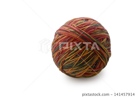 Colorful yarn ball resting on a plain surface, inviting creative hands to craft and weave unique patterns Colorful yarn ball resting on a plain surface, inviting creative hands to craft and weave unique patterns 141457914