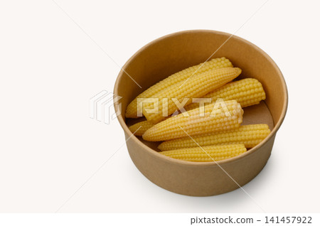 Fresh baby corn arranged neatly in a rustic brown bowl on a plain background Fresh baby corn arranged neatly in a rustic brown bowl on a plain background 141457922
