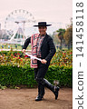 Portrait of a smiling, cheerful young man dressed as a Chilean huaso, celebrating and posing to dance cueca, a traditional Chilean dance. Chilean traditions, celebration, and culture. 141458118