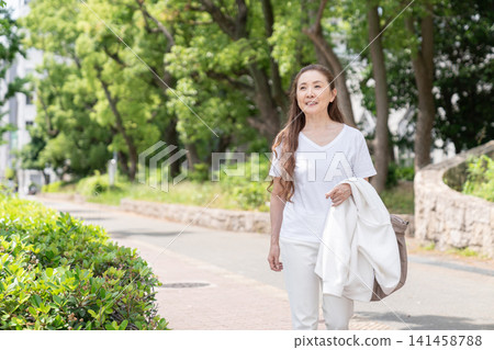 Senior woman going out Senior woman going out 141458788