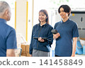 Staff members having a conversation 141458849
