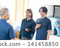 Staff members having a conversation 141458850