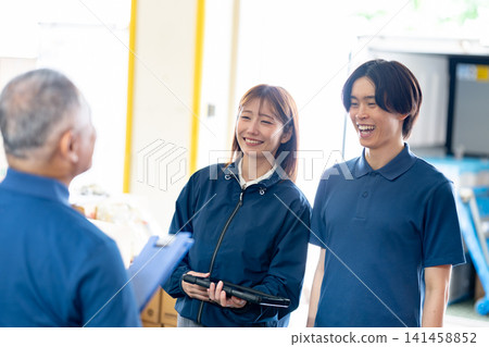 Staff members having a conversation Staff members having a conversation 141458852