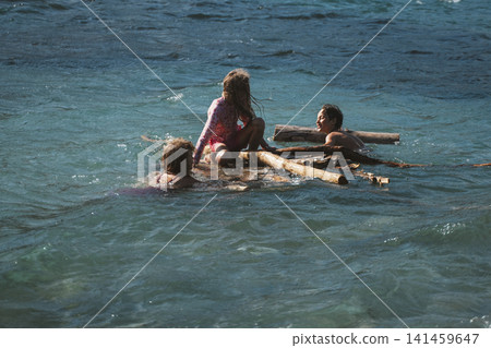 Children Enjoy Raft Adventure on the Water Children Enjoy Raft Adventure on the Water 141459647