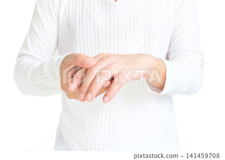 The man touches the wrist and thumb. He squeezes the knuckle of the thumb and wrist. He suffered a tendon injury, arthritis in his wrist, and de quervain's disease. The man touches the wrist and thumb. He squeezes the knuckle of the thumb and wrist. He suffered a tendon injury, arthritis in his wrist, and de quervain's disease. 141459708