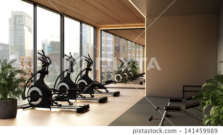 Modern fitness gym center with elliptical cross trainers and city view window Modern fitness gym center with elliptical cross trainers and city view window 141459989