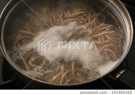 The process of boiling soba noodles. The process of boiling soba noodles. 141460168