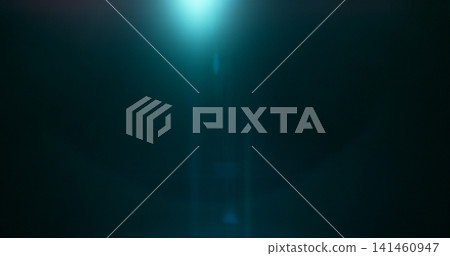 Abstract cinematic lens flare overlay with soft blue light rays, subtle optical glow and dark background. Premium VFX element for compositing, film editing, titles and motion graphics. 141460947