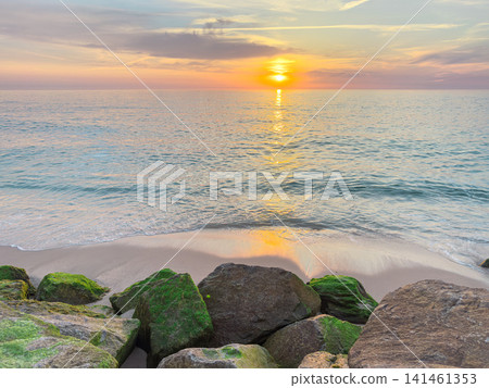 Golden sunset over Atlantic ocean at Furadouro beach Golden sunset over Atlantic ocean at Furadouro beach 141461353