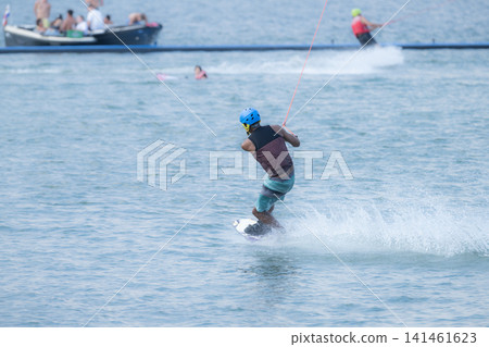 Man Wakeboarding On Hot Summer Day 141461623