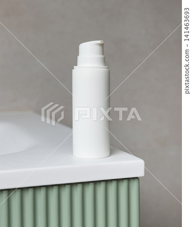 White pump cosmetic bottle mockup on green bathroom vanity. Skincare cosmetic packaging White pump cosmetic bottle mockup on green bathroom vanity. Skincare cosmetic packaging 141463693