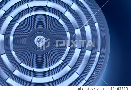 Abstract Precision Circle Texture With Blue Backlit Of Same Segments On Dark Blue Background Abstract Precision Circle Texture With Blue Backlit Of Same Segments On Dark Blue Background 141463713
