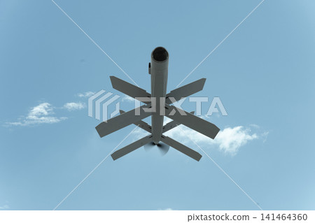 Bottom view of an attack drone emphasizes the danger of aerial strikes surveillance and modern military operations. Bottom view of an attack drone emphasizes the danger of aerial strikes surveillance and modern military operations. 141464360