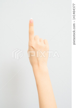A Japanese woman's hands with nail polish on a white background. A Japanese woman's hands with nail polish on a white background. 141464377