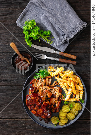BBQ Shredded Pork Dinner Served With Crispy Fries BBQ Shredded Pork Dinner Served With Crispy Fries 141464946