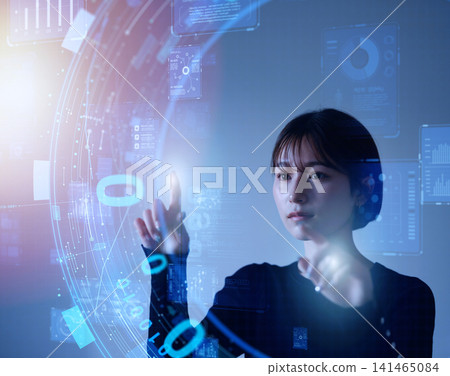Woman touching a digital interface Woman touching a digital interface 141465084