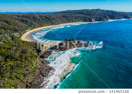 Aerial view of Sugarloaf Point and Boat Beach surrounded by crystal-clear turquoise water at Seal Rocks, NSW, Australia, showcasing the rugged coastline and pristine beauty of this iconic coast Aerial view of Sugarloaf Point and Boat Beach surrounded by crystal-clear turquoise water at Seal Rocks, NSW, Australia, showcasing the rugged coastline and pristine beauty of this iconic coast 141465188