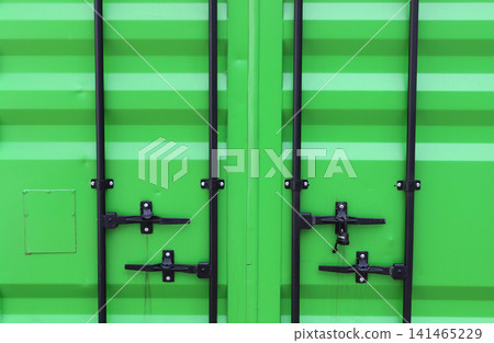 Locking Handles And Bolted Locking Beams On A Green Metal Cargo Container Door. Freight Container Door Texture. Metal Cargo Box Pattern Locking Handles And Bolted Locking Beams On A Green Metal Cargo Container Door. Freight Container Door Texture. Metal Cargo Box Pattern 141465229