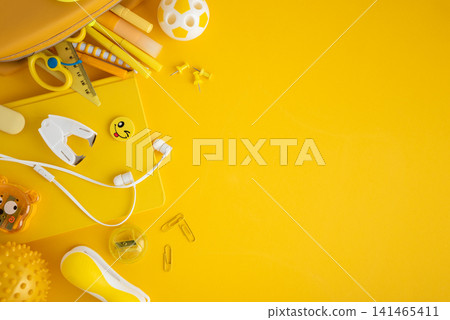 Yellow school and office supplies border on bright background 141465411