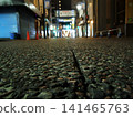 A shopping street with cobblestones at night 141465763