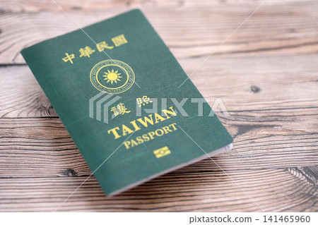 Taiwan passport on table close up. Official identification document book for citizens of Taiwan Taiwan passport on table close up. Official identification document book for citizens of Taiwan 141465960