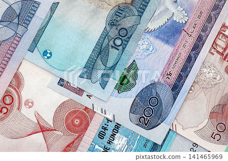 Ethiopian birr paper banknotes pile on table. Ethiopia ETB currency money bills in big amount Ethiopian birr paper banknotes pile on table. Ethiopia ETB currency money bills in big amount 141465969