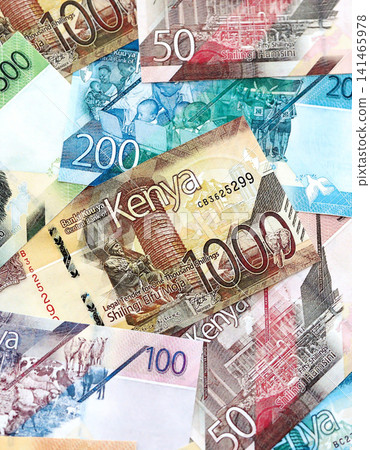 Kenyan shilling paper banknotes pile on table. Kenya KES currency money bills in big amount Kenyan shilling paper banknotes pile on table. Kenya KES currency money bills in big amount 141465978