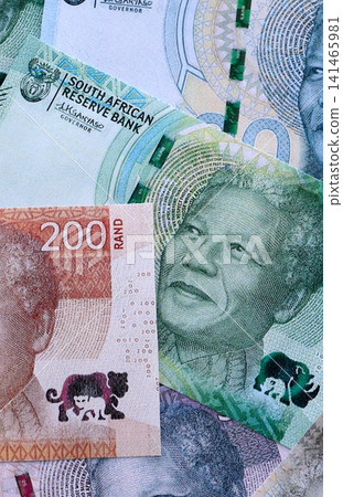 South African rand paper banknotes pile on table. South Africa ZAR currency money bills in big amount South African rand paper banknotes pile on table. South Africa ZAR currency money bills in big amount 141465981