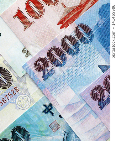 Taiwanese dollar paper banknotes pile on table. Taiwan TWD currency money bills in big amount Taiwanese dollar paper banknotes pile on table. Taiwan TWD currency money bills in big amount 141465986