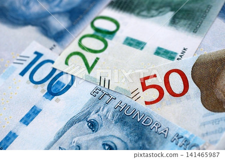 Swedish krona paper banknotes pile on table. Sweden SEK currency money bills in big amount Swedish krona paper banknotes pile on table. Sweden SEK currency money bills in big amount 141465987