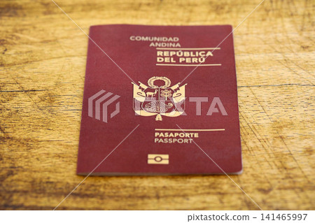 Peruvian passport on table close up. Official identification document book for citizens of Peru Peruvian passport on table close up. Official identification document book for citizens of Peru 141465997