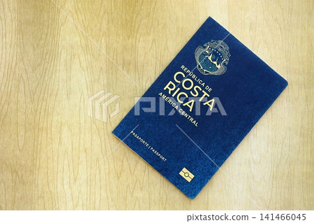 Costa Rican passport on table. Official identification document book for citizens of Costa Rica Costa Rican passport on table. Official identification document book for citizens of Costa Rica 141466045