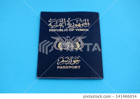 Yemeni passport on table close up. Official identification document book for citizens of Yemen 141466054