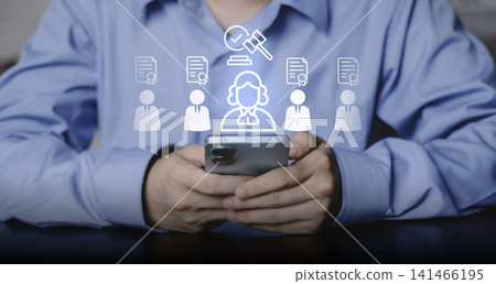 Businessman using smartphone for digital legal services. Glowing icons of lawyer, gavel, and certified documents for professional advice, compliance, and justice system Businessman using smartphone for digital legal services. Glowing icons of lawyer, gavel, and certified documents for professional advice, compliance, and justice system 141466195