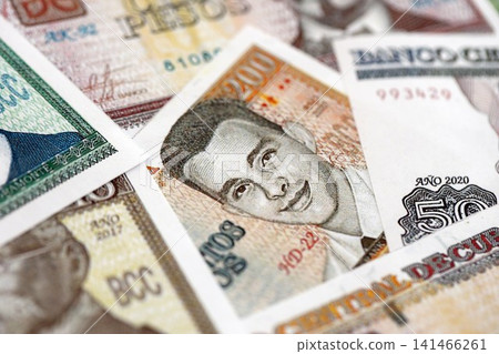 Cuban peso money bills pile on table. Cuba banknotes of CUP currency close up. Concept of business 141466261