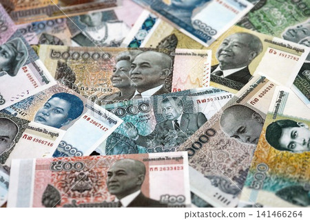 Cambodian riel money bills pile on table. Cambodia banknotes of KHR currency close up Cambodian riel money bills pile on table. Cambodia banknotes of KHR currency close up 141466264