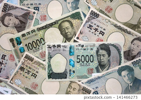 Japanese yen money bills pile on table. Japan banknotes of JPY currency. Concept of business 141466273