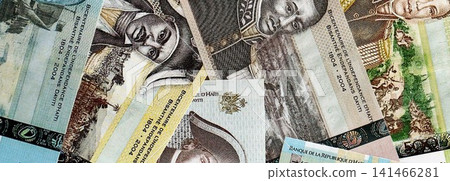 Haitian gourde money bills pile on table. Haiti banknotes of HTG currency. Concept of business Haitian gourde money bills pile on table. Haiti banknotes of HTG currency. Concept of business 141466281