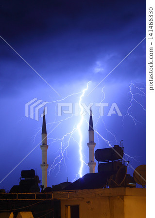 Dangerous storm of lightning and lightning in the clouds that touch the ground Dangerous storm of lightning and lightning in the clouds that touch the ground 141466330