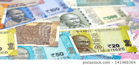 Big pile of Indian Rupees money bills banknotes close up. Lots of money of Indian INR currency cash Big pile of Indian Rupees money bills banknotes close up. Lots of money of Indian INR currency cash 141466364