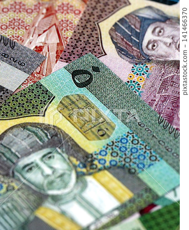 Omani rial paper banknotes pile on table. Oman OMR currency money bills in big amount Omani rial paper banknotes pile on table. Oman OMR currency money bills in big amount 141466370