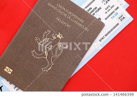 Luxembourg passport and airlines boarding pass tickets. Travel flights and avia tourism in Europe Luxembourg passport and airlines boarding pass tickets. Travel flights and avia tourism in Europe 141466399