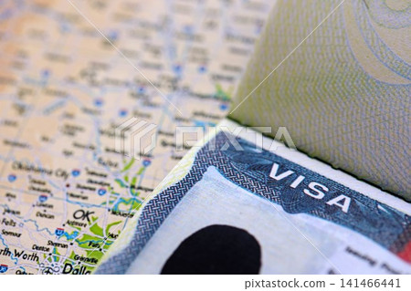 Visa to the USA and a trip to United States. Visa sign with background of United States map Visa to the USA and a trip to United States. Visa sign with background of United States map 141466441