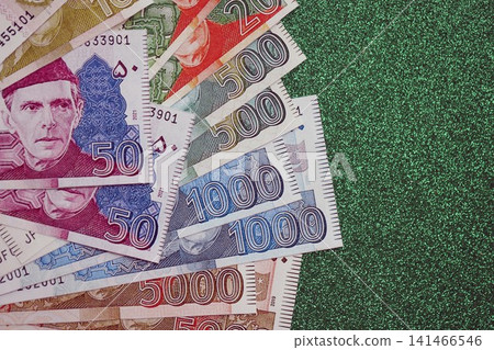Pakistan rupees banknotes on glitter green background. The current Pakistan money bills Pakistan rupees banknotes on glitter green background. The current Pakistan money bills 141466546