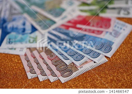 Pakistan rupees banknotes on golden yellow background. The current Pakistan money bills Pakistan rupees banknotes on golden yellow background. The current Pakistan money bills 141466547