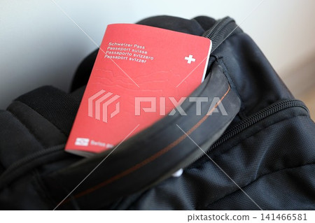 Swiss passport on travel bag. Pass on bag close up Swiss passport on travel bag. Pass on bag close up 141466581